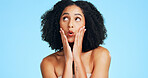 Thinking, beauty and woman in studio with funny face for makeover, cosmetics and spa options. Cosmetology, space and person with decision for grooming, makeup and salon treatment on blue background