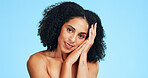Portrait, skincare and happy woman in studio for shine, dermatology and wellness on blue background. Cosmetic, smile or person with facial glow for natural beauty, aesthetic or smooth skin with space
