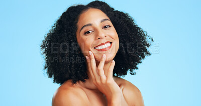 Buy stock photo Portrait, skincare and woman in studio for natural glow, beauty and wellness on blue background. Cosmetic, touch face and happy person with aesthetic, dermatology or self care with healthy skin