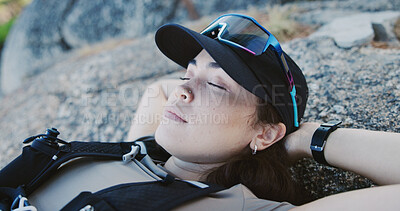 Buy stock photo Sleeping, woman and tired of hiking on rocks for endurance challenge, intense trail and break. Peaceful hiker, person and exhausted outdoor with resting, trekking fatigue and recovery nap in nature