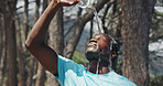 Fitness, pour or black man in nature with water, cardio break or cool down in outdoor practice. Hydration, fatigue or runner with h2o splash, training pause or exercise burnout with recovery.