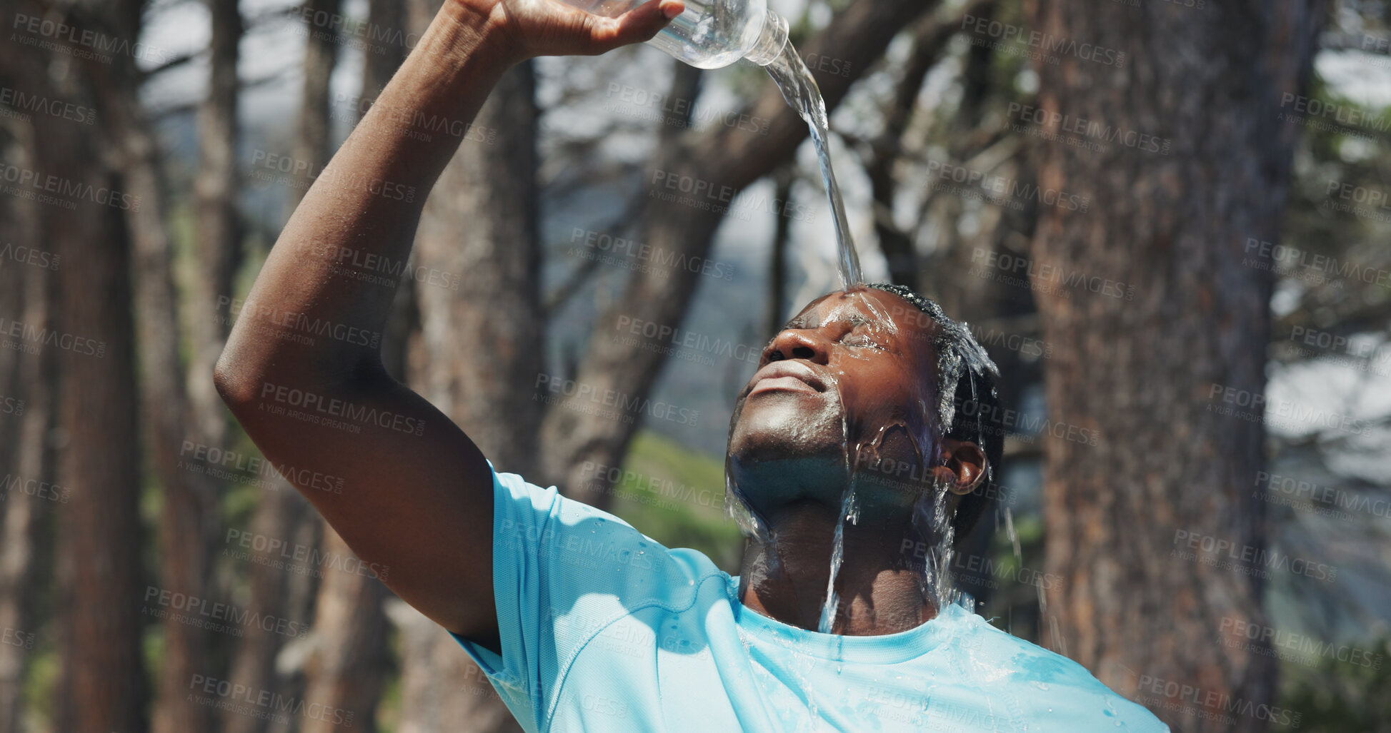 Buy stock photo Fitness, pour or black man in nature with water, cardio break or cool down in outdoor practice. Hydration, fatigue or runner with h2o splash, training pause or exercise burnout with recovery.