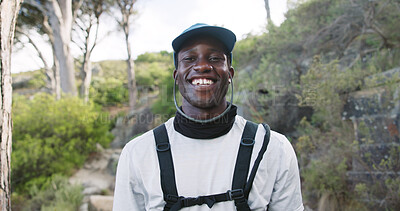 Buy stock photo Portrait, hiking and happy man with hobby in woods, outdoor and travel with hydration vest in nature. Hiker, exploring and black person with smile on getaway, break or vacation for wellness in Kenya