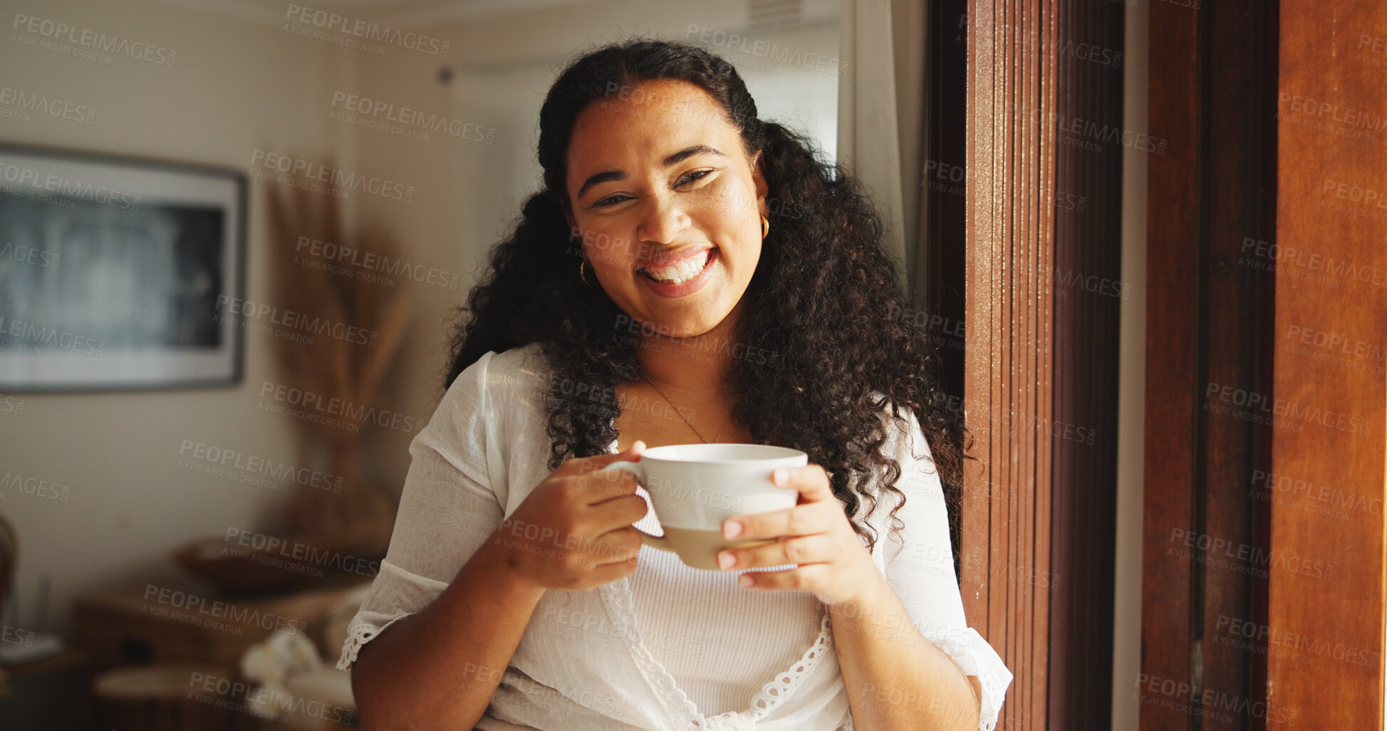 Buy stock photo Portrait, woman and happy with coffee in home for peaceful morning, weekend break and me time. Smile, african person and relax with beverage in apartment for wellness, comfortable and calm afternoon