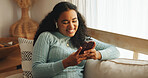 Woman, phone and online comedy in home with earphones, laughing and relax with chat on social media. Meme, texting or female person with website joke, humor blog or podcast with happiness in lounge
