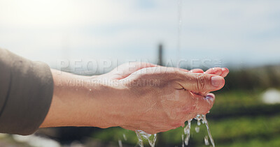 Buy stock photo Farming, water and agriculture with hands in nature for field health, growth and irrigation. Sustainability, countryside and organic farmer with person and splash outdoor for wellness and hydration