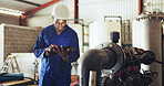 Technician, man and inspection with tablet, industrial warehouse or checking water system for safety. Serious, inspector and black person with tech for quality control, maintenance and leak detection