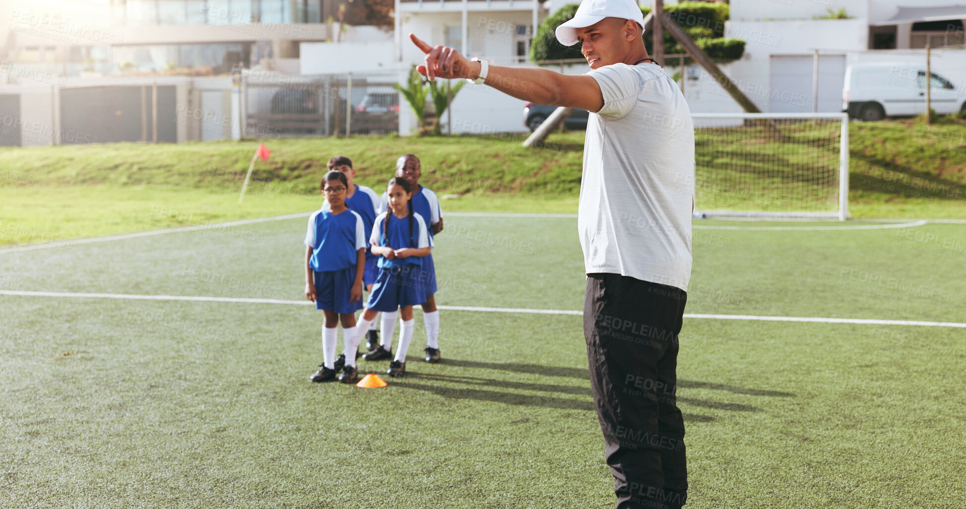 Buy stock photo Coach, team and kids on field for soccer, practice and help with game play or pointing. Man, children and football match training for exercise, youth athlete group and fitness outdoor at pitch