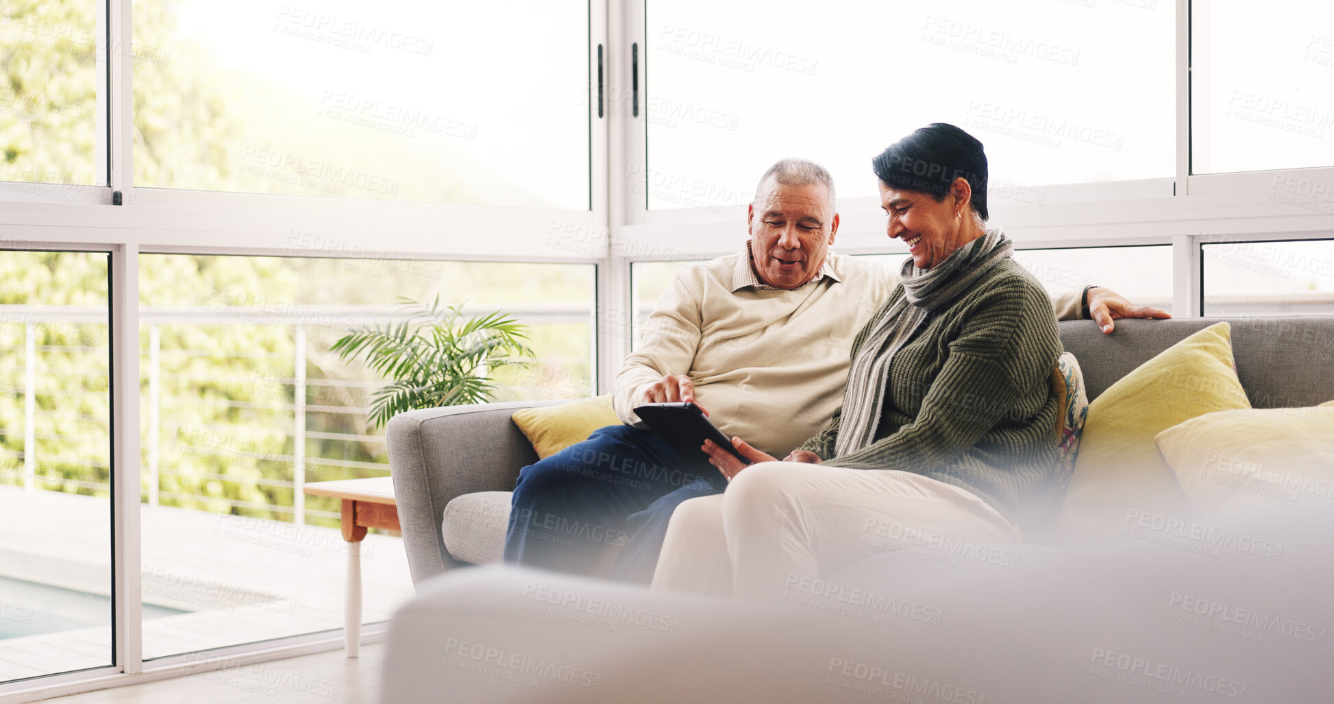 Buy stock photo Relax, tablet and senior couple on sofa in home with watching film show or series together. Smile, calm and elderly woman with man in living room for bonding with streaming movie on app in house.
