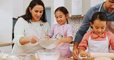 Buy stock photo Happy, family and baking with children in kitchen, growth and learning culinary skills with parents. Teaching, kids and help with dessert preparation, development and people with ingredients in house