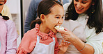 Baking, taste and child with parents in kitchen for learning, help and bonding with dessert. Family, happy and mother with kids with ingredients, food and cookies for dough, sweet treat and icing