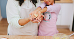 Baking, heart and hands of child with mom in kitchen for learning, help and bonding with dessert. Family, love and parent with girl with ingredients, food and shape for dough, cookies and recipe