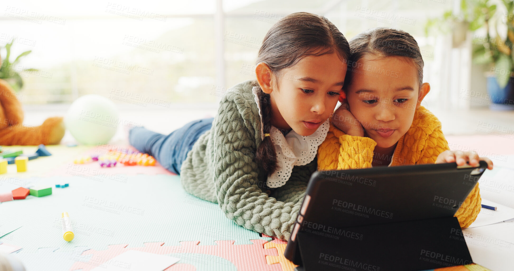 Buy stock photo Reading, tablet and learning with children in home for math assessment, studying or digital lesson. Online course, education app and student project with kids in house for research and growth