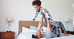 Happy, flying and dad with child in bedroom for playing, bonding and relax together in morning. Family, home and father with boy for playful relationship, games and laugh for connection on weekend