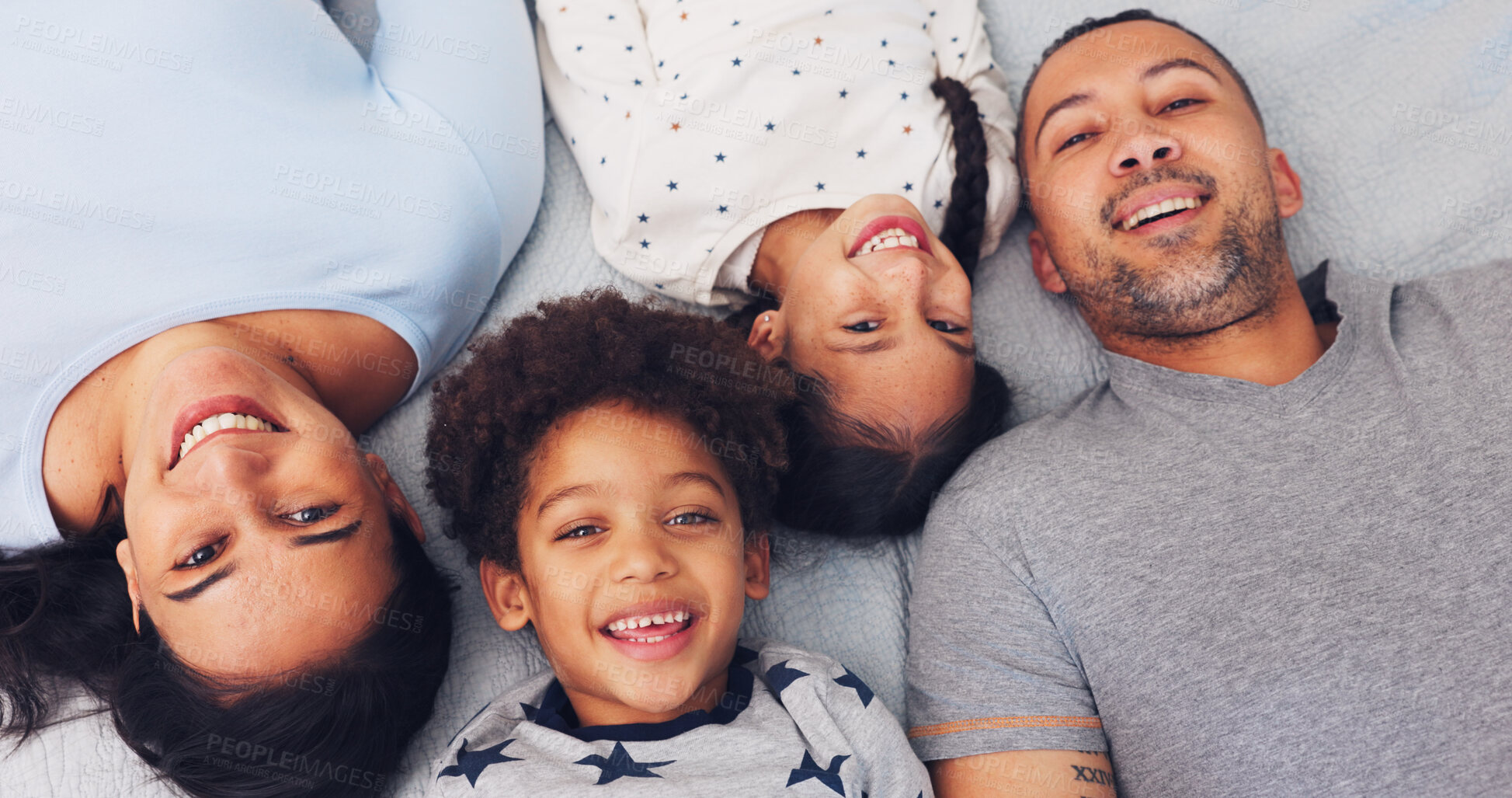 Buy stock photo Portrait, above and parents with children on bed for love, bonding and relax together in morning. Family, home and happy mom, dad and kids for relationship, smile and laugh for connection on weekend