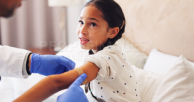 Buy stock photo Plaster, doctor and child in home with injury, accident or sore with first aid care at consultation. Help, checkup and medical pediatrician with girl kid for hurt arm with bandage in bedroom at house