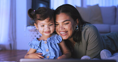 Buy stock photo Night, tablet and mom with child on floor for internet, online streaming and connection on weekend. Family, happy and mother with girl on digital tech for website, watching videos or bonding together