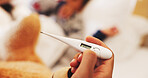 Hand, sick and thermometer with child in bedroom for worry, temperature spike and help. Medical, support and illness with parent and kid in family home for infection, disease and influenza virus