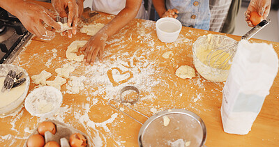 Buy stock photo Baking, hands and heart with family in kitchen in home for support, cookies and bonding together. Flour, dessert and teaching with parent and child in house for guidance, kneading and recipe
