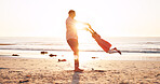 Spin, sunrise and dad with kid at beach for playful relationship on holiday, vacation and weekend. Sunshine, family and father with girl by ocean for playing, laughing and bonding on summer getaway