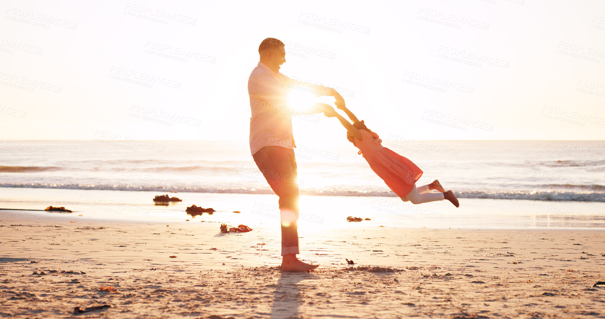 Buy stock photo Spin, sunrise and dad with kid at beach for playful relationship on holiday, vacation and weekend. Sunshine, family and father with girl by ocean for playing, laughing and bonding on summer getaway
