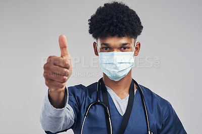 Buy stock photo Face mask, surgeon and man with thumbs up in studio for medical service, support and safety. Healthcare nurse, ppe and like hand sign for thank you, compliance success or portrait on white background