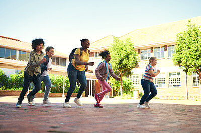 Buy stock photo Happy, children and running at school with recess, bonding together or education for skill development. Students, friends and energy outdoor on break with diversity, wellness and learning for growth.