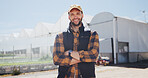 Arms crossed, confidence and man with portrait for agriculture, sustainability and stock harvest. Greenhouse, plant and farmer with agro business for crops, quality control or hydroponics produce