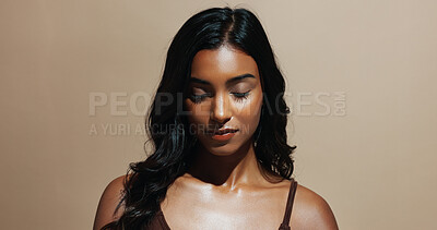 Buy stock photo Makeup, beauty and Indian woman with cosmetics for grooming and salon treatment for hair care benefits. Space, person and thinking with cosmetology, glowing skin and hairstyle on studio background.