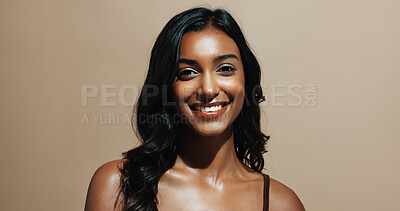 Buy stock photo Portrait, skincare and happy woman in studio, shine and natural dermatology on brown background. Confidence, smile and person with beauty cosmetics for glow, wellness and self care for healthy skin
