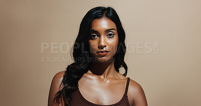 Buy stock photo Portrait, skincare and woman in studio, confidence and natural dermatology on brown background space. Glow, healthy skin and serious person with beauty cosmetics for shine, wellness and cosmetology