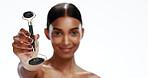 Woman, hand and face roller in studio with skincare, beauty cosmetics or lymphatic drainage benefits. Mockup space, portrait and person with massage tools, wellness or dermatology on white background