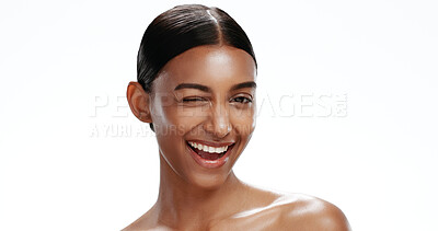 Buy stock photo Portrait, woman and wink with skincare in studio for natural beauty, healthy skin and shine. Space, female person and gesture with cosmetics, facial hydration and treatment glow on white background
