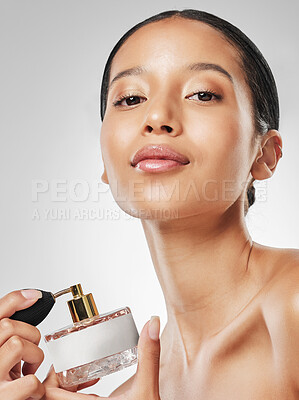 Buy stock photo Body care, woman and portrait with perfume in studio for beauty, fresh scent and aesthetic product. Grooming, girl and cosmetics bottle on white background for luxury fragrance, hygiene and wellness