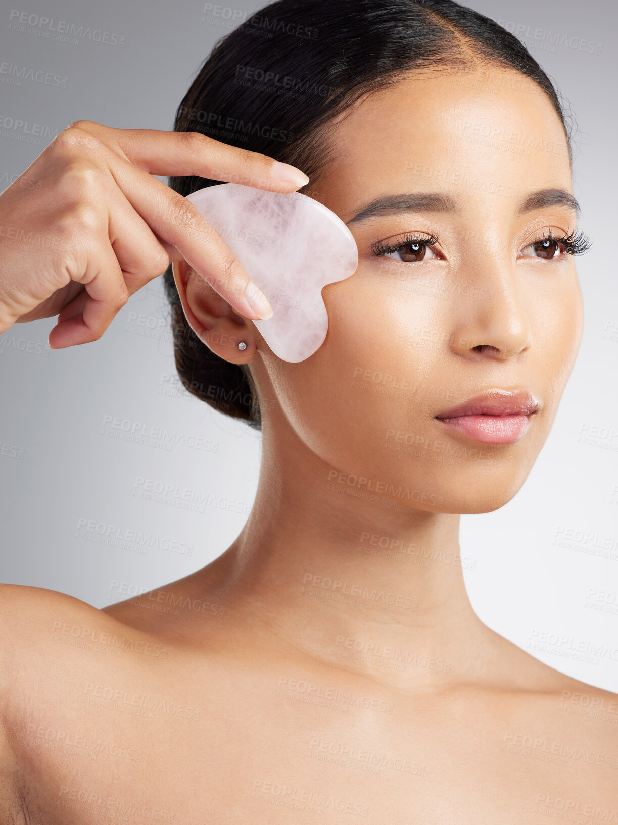 Buy stock photo Skincare, facelift or woman with gua sha, tool contour or massage in facial routine. Wellness, sculpting or female person with stone, lymphatic drainage or irritation reduction on studio background.