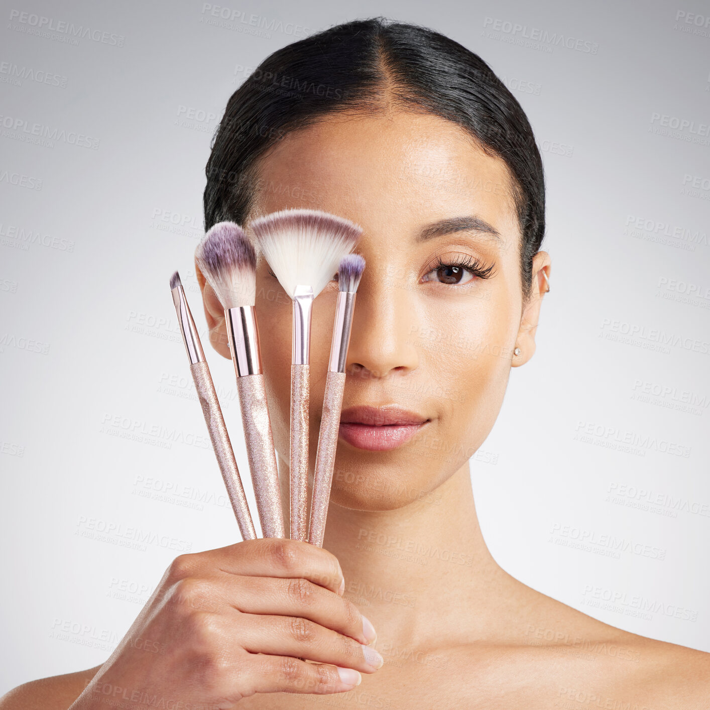 Buy stock photo Brushes, makeup and portrait of woman in studio for cosmetics, makeover or transformation. Beauty, recommend and variety with person on white background for change, facial aesthetic or foundation