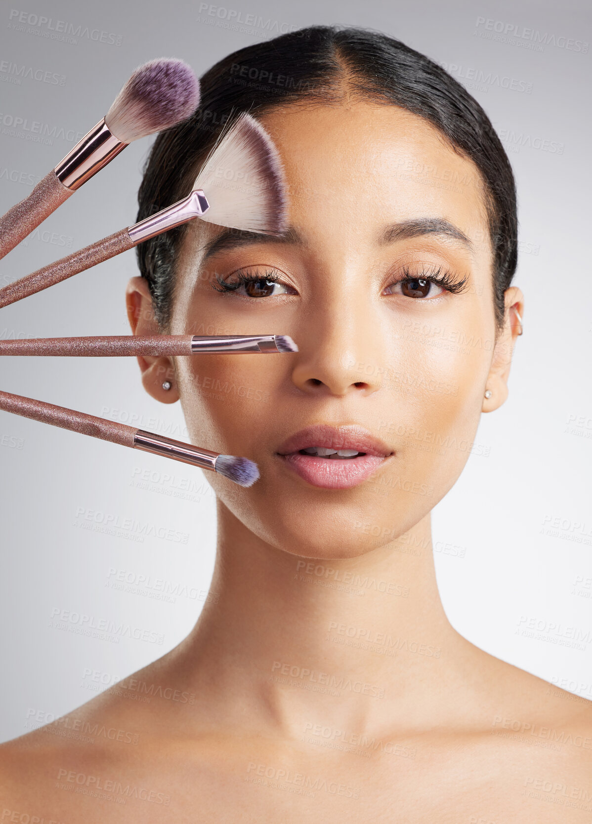 Buy stock photo Beauty, brushes and portrait of woman in studio for cosmetics, makeover or transformation. Makeup, recommend and variety with person on white background for change, facial aesthetic or foundation