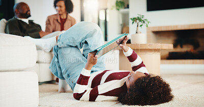 Buy stock photo Child, relax and floor with tablet at house for research, reading ebook and education video. Parents, daughter and digital for elearning, browsing website and academic games for knowledge in lounge