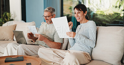 Buy stock photo Couple, documents and celebration with finance in home with revenue increase, success or goals in lounge. Mature people, fist pump and excited with budget review, investment and profit in living room