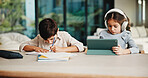 Homework, headphones and children in home with tablet, activity and project or academic app. Homeschool, tech and siblings in kitchen with document, digital lesson or assessment in remote education