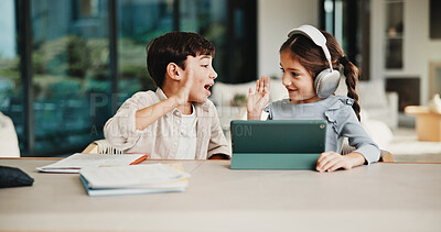 Buy stock photo Homework, high five and children in home with tablet, online activity and project on academic app. Homeschool, tech and siblings in kitchen with teamwork, lesson or assessment for remote education