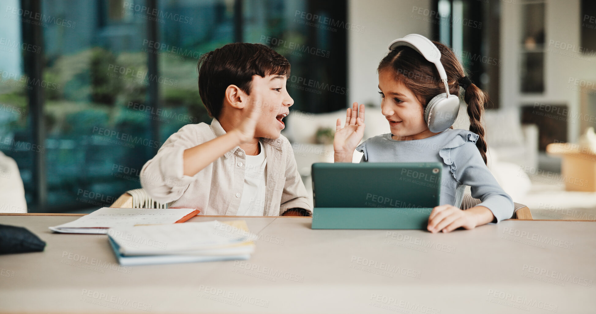 Buy stock photo Homework, high five and children in home with tablet, online activity and project on academic app. Homeschool, tech and siblings in kitchen with teamwork, lesson or assessment for remote education