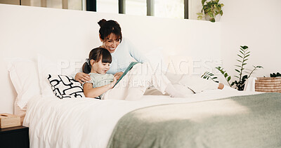Buy stock photo Mother, child and bonding on bed with tablet, digital app and play knowledge game for development. Happy family, mom and daughter learning in home with tech, website or educational gaming for growth.