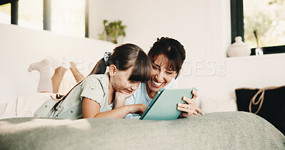 Buy stock photo Mother, daughter and smile in bedroom with tablet, website or play knowledge game for development. Happy family, mom and child typing in home with tech, learning app or educational gaming for growth.