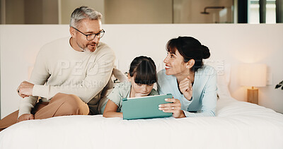 Buy stock photo Tablet, relax and family on bed in home with discussion on movie, film or series choice together. Happy, digital technology and girl child with mother and father for streaming show in bedroom.