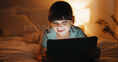 Buy stock photo Night, relax and kid with tablet in bedroom for game, streaming cartoon or watch show on internet. Tech, smile and girl on bed at home for movie, subscription service or entertainment on weekend