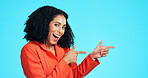 Business, woman and pointing with portrait in studio for advertising, vacancy and job interview. Smile, female person or gesture for announcement, hiring guide and onboarding offer on blue background
