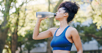 Buy stock photo Fitness, woman and drinking water for thirst at park with cardio break, runner nutrition and health. Athlete, person and cold beverage in nature for exercise electrolytes, hydration and healthy detox