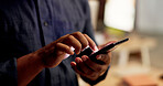 Hands, phone and texting at night in office with contact, scroll or notification at finance company. Person, typing and chat with mobile network, application or social media at investment agency