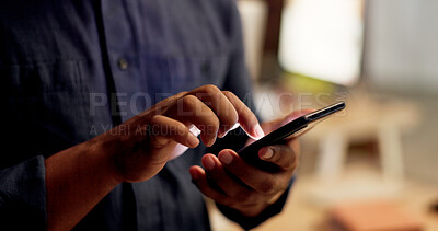 Buy stock photo Hands, phone and texting at night in office with contact, scroll or notification at finance company. Person, typing and overtime with mobile network, application or social media at investment agency